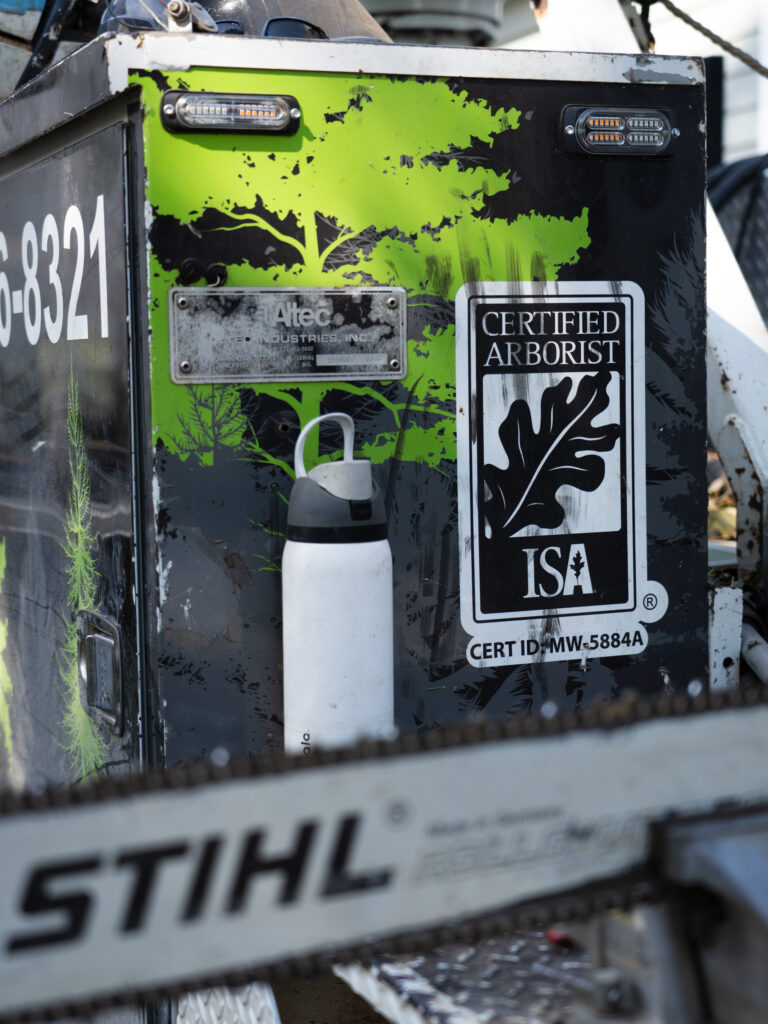 ISA Certified Arborist logo displayed on a Wichita Tree Service truck